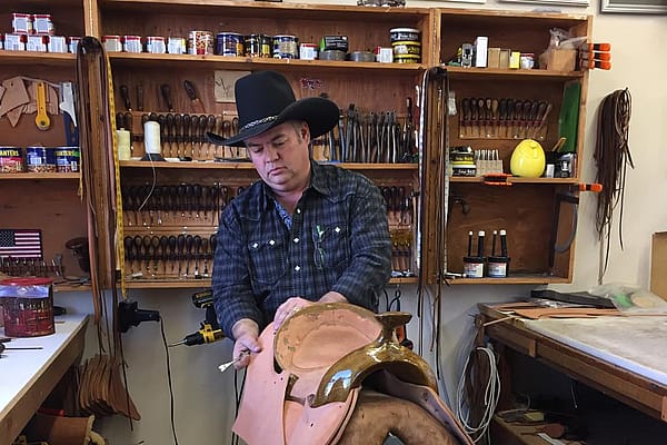 Keith Seidel demonstrating how to put together a saddle.