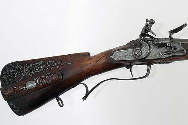 Click the image to view this example of a flintlock system closer. This is a German Flintlock Rifle with an octagon barrel. Gift of Olin Corporation, Winchester Arms Collection. 1988.8.391