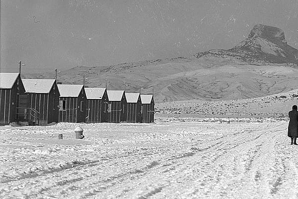 Japanese-American women walk to their barracks at Heart Mountain Relocation Center. MS 89 Jack Richard Photograph Collection, McCracken Research Library. PN.89.111.21238.3 (detail)