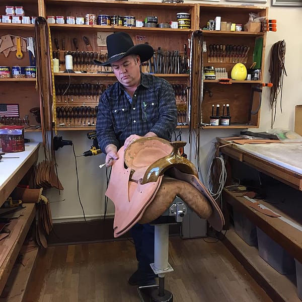 Keith Seidel demonstrating how to put together a saddle.