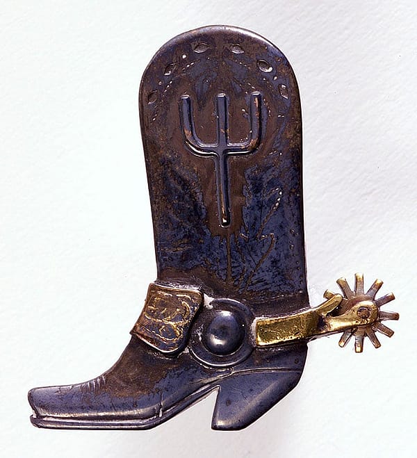 Cowboy boot bolo tie slide with Pitchfork Ranch brand. Sterling silver, 10-karat gold, and brass. Edward H. Bohlin, Inc. 1.69.2432