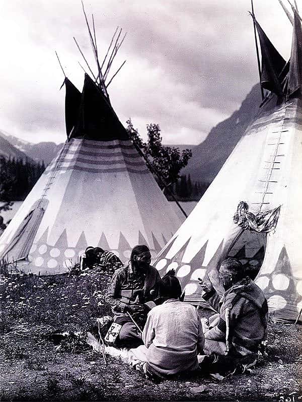 "Tail-Feathers-Coming-Over-The-Hill, Yellow Wolf, and James Willard Schultz (Apikuni) at Upper Two Medicine Lake." Roland Reed recorded a visit of author J.W. Scott in a Blackfeet camp. MS 43 Roland Reed Collection. P.43.57