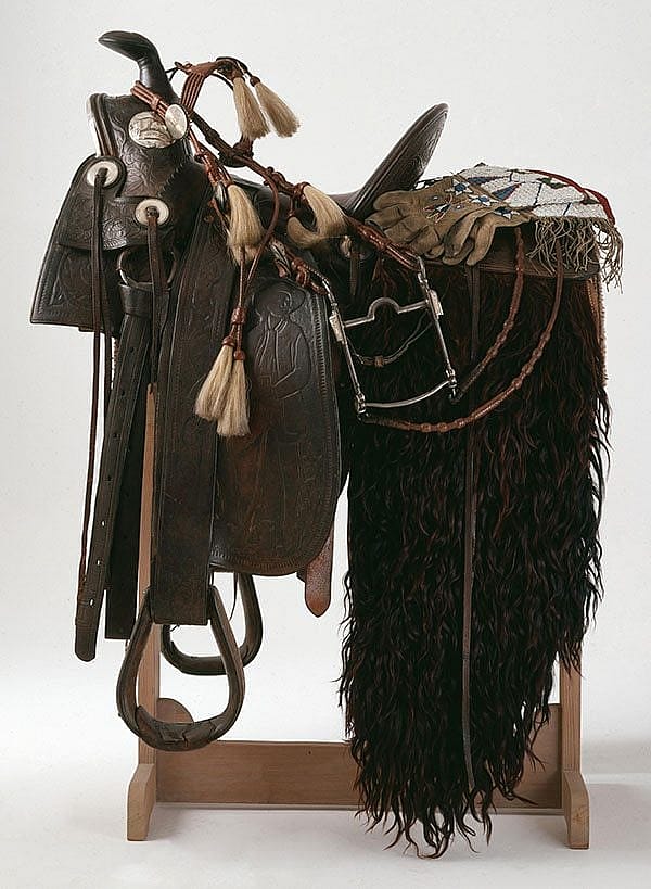 Saddle, ca. 1893, William Cody Boal Collection, 1.69.45 / Bridle and bit, ca. 1915, Mary Jester Allen Collection, 1.69.44A and B / Gauntlets, ca. 1885, Gift of Mrs. S.W. Harding, 1.69.2661 / Serape, ca. 1910, William Cody Boal Collection, 1.69.2639