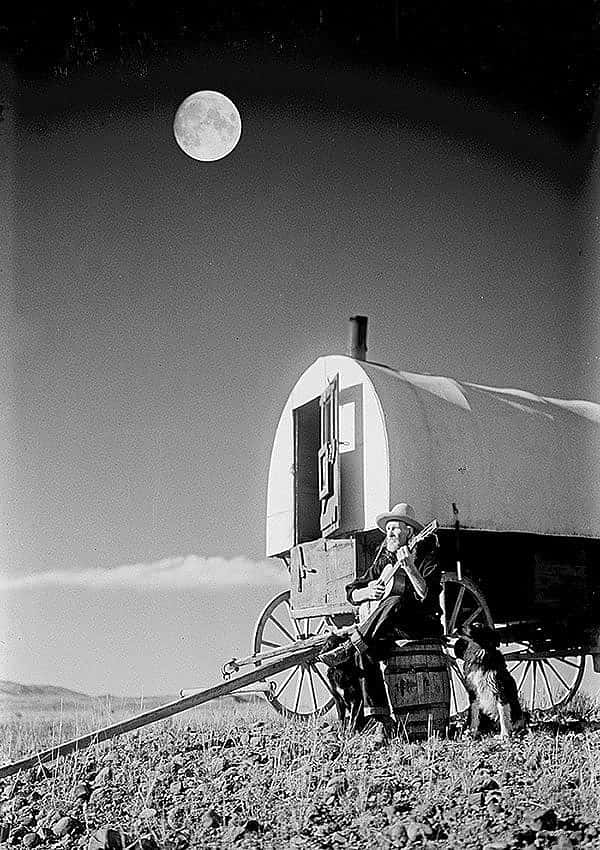 Sheepherder Jack Scott playing guitar in the moonlight, ca. 1930. Charles J. Belden photograph; glass plate negative. MS 3 Charles Belden Collection. PN.67.368 