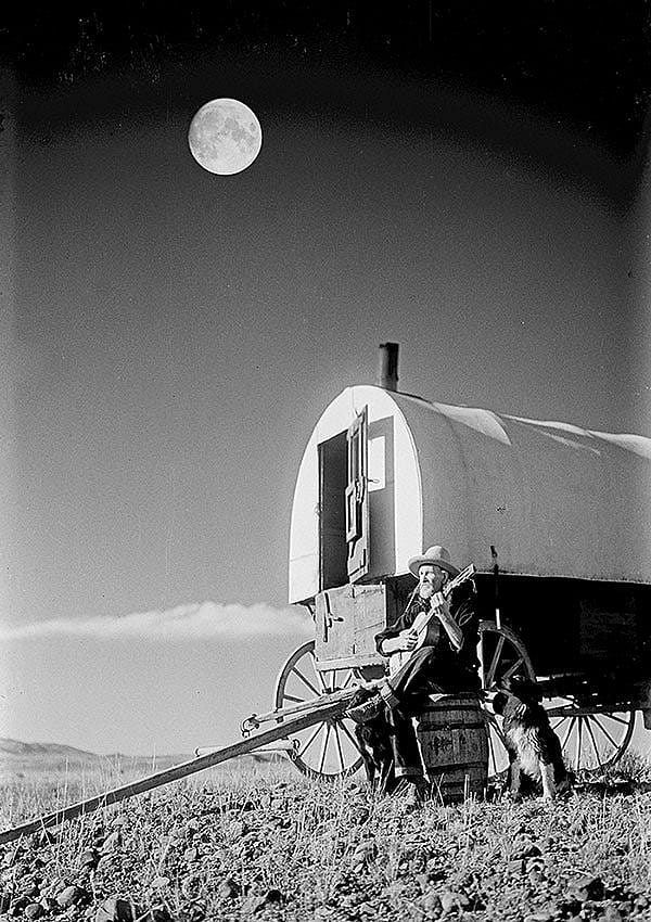 Sheepherder Jack Scott playing guitar in the moonlight, ca. 1930. Charles J. Belden photograph; glass plate negative. MS 3 Charles Belden Collection. PN.67.368