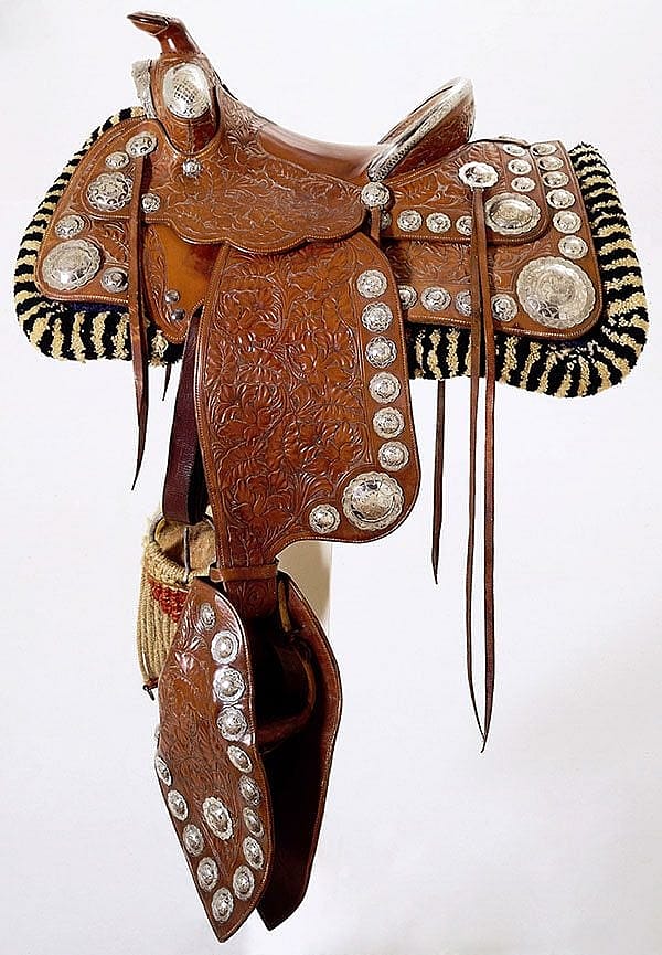 Saddle, Victor Alexander Company, Hayward, California, c. 1942. Russet leather, silver. Gift of Mark Mayer. 1.69.2477