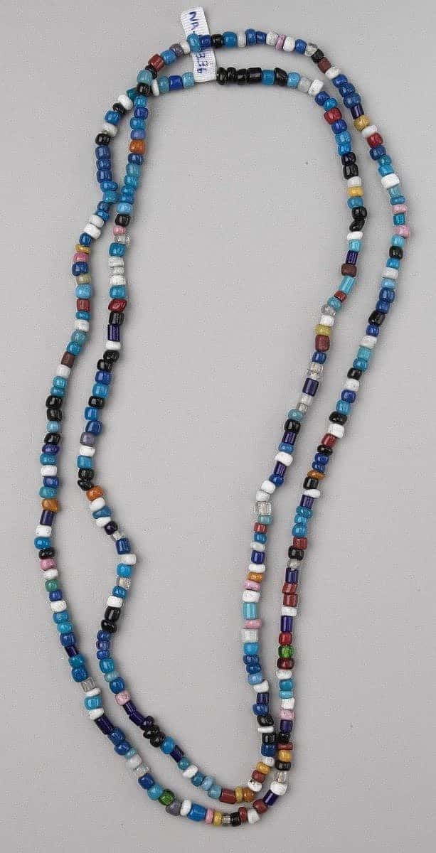 Assorted glass trade beads on a necklace. NA.203.36 