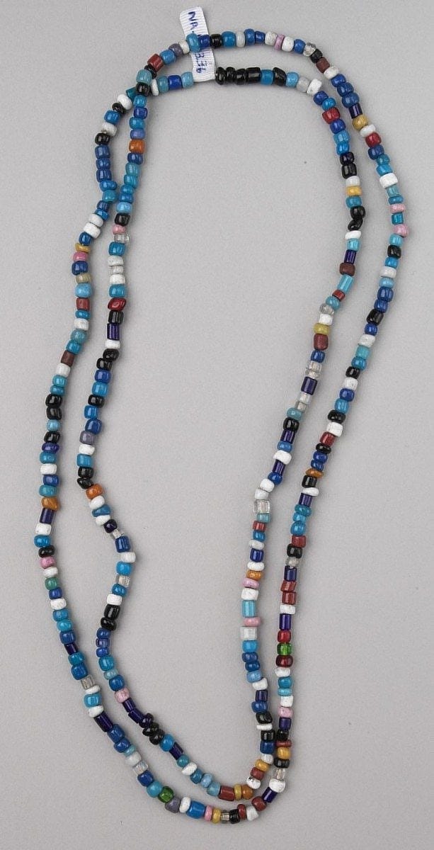 Assorted glass trade beads on a necklace. NA.203.36 