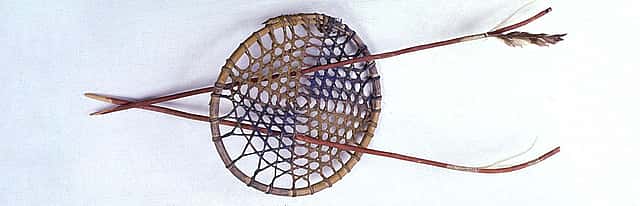 Hoop and arrows. Sioux, Northern Plains. Wood, rawhide thongs, red paint, blue paint, yellow paint, horse hair, and feathers. Royal B. Hassrick Indian Collection. NA.503.5A-C