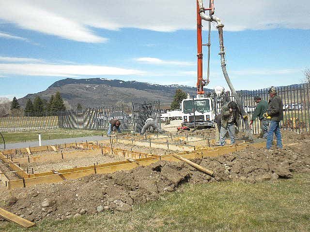 Pouring the concrete for the footings.