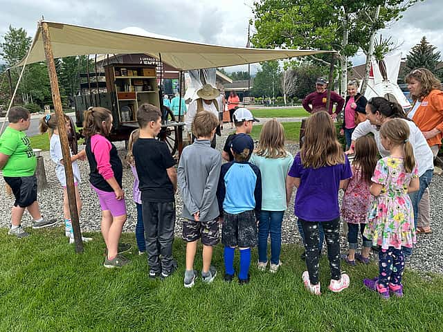 Students learning from "Cookie" Ron Reed at the chuckwagon cooking demonstration at the Buffalo Bill Center of the West.