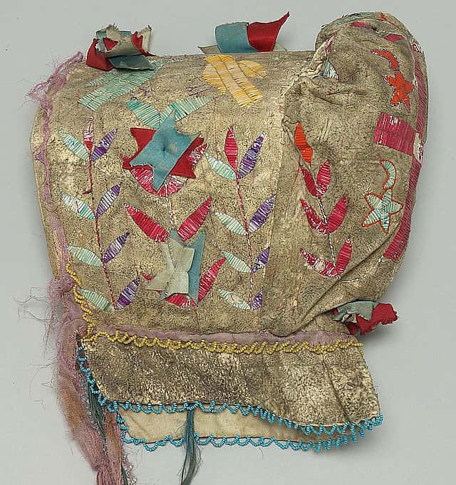 Sunbonnet, Dakota (Sioux), Northern Plains, ca. 1900. Tanned deer hide, dyed porcupine quills, glass beads, canvas, silk ribbons. Plains Indian Museum Collection. NA.202.94 (detail)