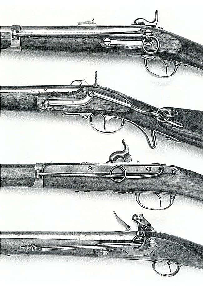 An array of 18th and 19th century cavalry carbines, depicting the rings and bars for attachment to the soldier's cross belt and snap hook: U.S. M1847 Muzzleloading cavalry musketoon, Austrian M1844 cavalry carbine, U.S. M1842 Hall's Patent dragoon carbine, Portuguese copy of English 1756 carbine.