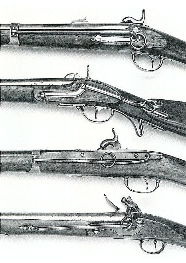 An array of 18th and 19th century cavalry carbines, depicting the rings and bars for attachment to the soldier's cross belt and snap hook: U.S. M1847 Muzzleloading cavalry musketoon, Austrian M1844 cavalry carbine, U.S. M1842 Hall's Patent dragoon carbine, Portuguese copy of English 1756 carbine.
