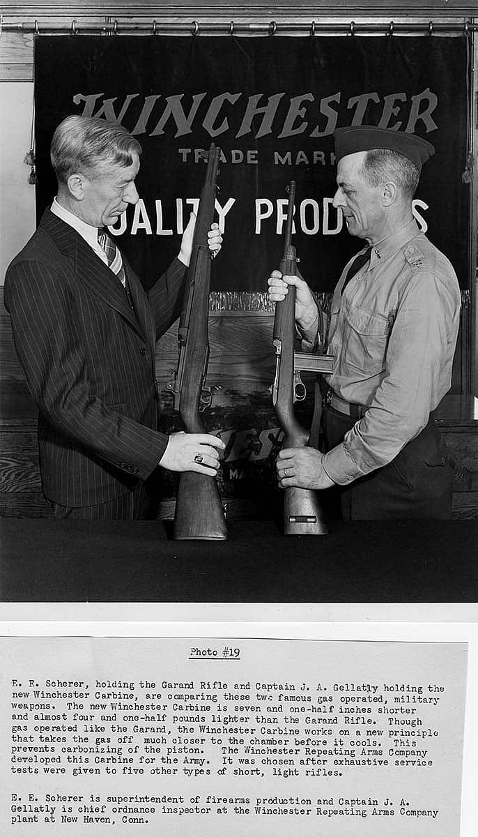 E.E. Scherer holding the Garand and Captain J.A. Gellatly holding the M1 Carbine. MS 20 Winchester Repeating Arms Company Archives Collection. P.20.3032.1