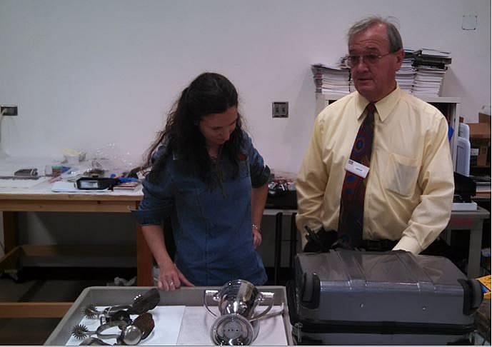 Intern Blanca Guerra and Dr. Kaiser discussing the metal objects during an analysis session.