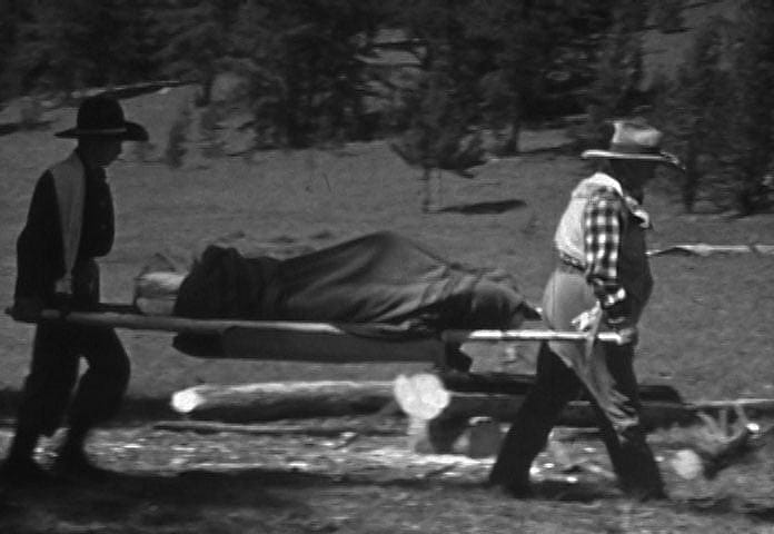 Barbara Nichols carried on a stretcher to Bill Monday's plane, 1938. Author's photo.