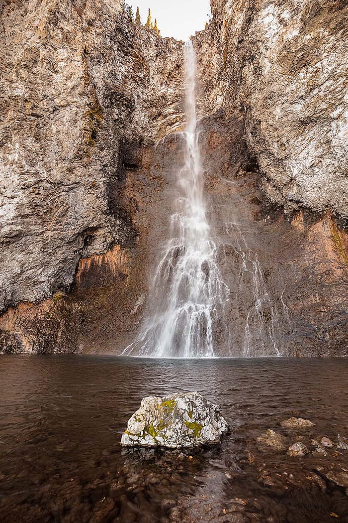 A popular hiking destination on the west side of Yellowstone National Park, Fairy Falls takes on a sunset glow. Photo by Jacob W. Frank.