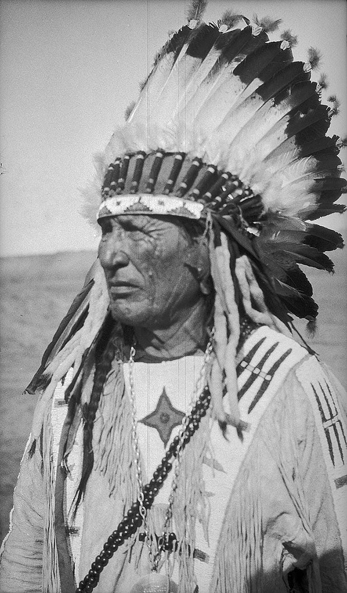Richard Wooden Leg wearing headdress, ca. 1922-1935. MS 165 Thomas B. Marquis Collection. PN.165.1.56