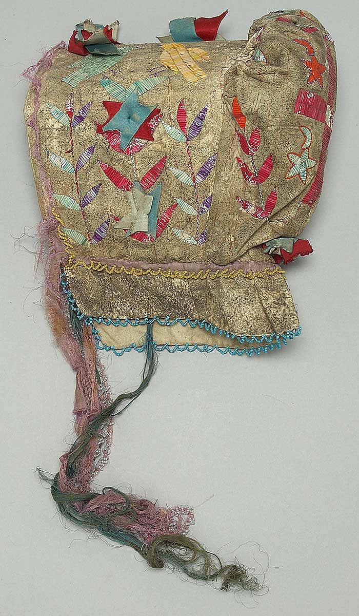 Sunbonnet, Dakota (Sioux), Northern Plains, ca. 1900. Tanned deer hide, dyed porcupine quills, glass beads, canvas, silk ribbons. Plains Indian Museum Collection. NA.202.94