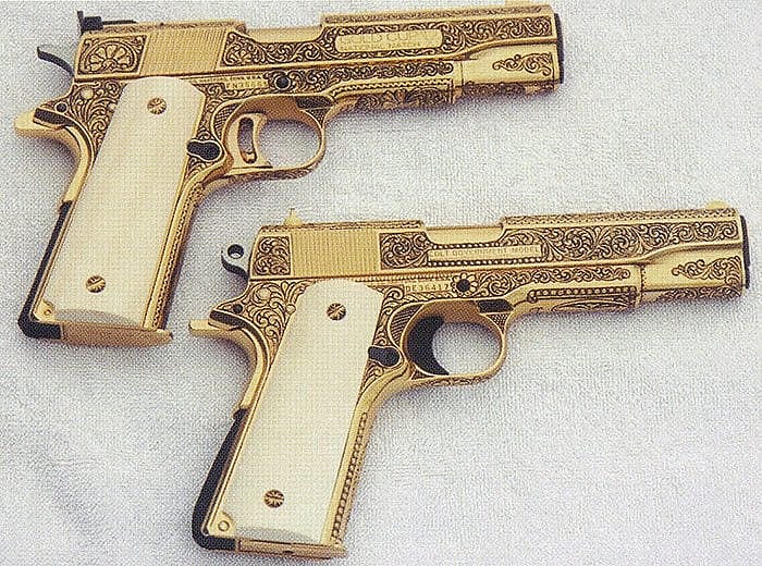Johns engraved matched pair of gold-finished handguns. Photo courtesy of Bill Johns.