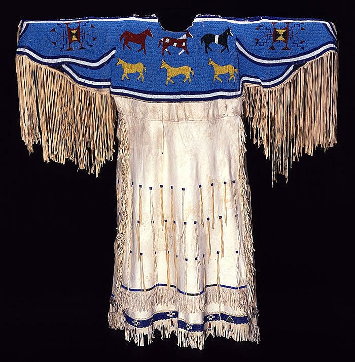 Sioux dress, Northern Plains, ca. 1900s. Deerskin, seed beads, tin cones. Gift of Mr. and Mrs. Henry Harrison. NA.202.70