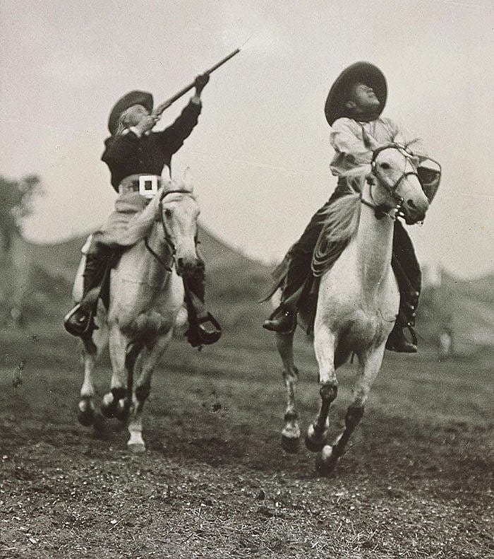 The Wild West certainly had all the trappings of excitement and drama. Here Buffalo Bill shoots glass targets from horseback as a second cowboy tosses the balls, ca. 1908. Original Buffalo Bill Museum Collection. P.69.3