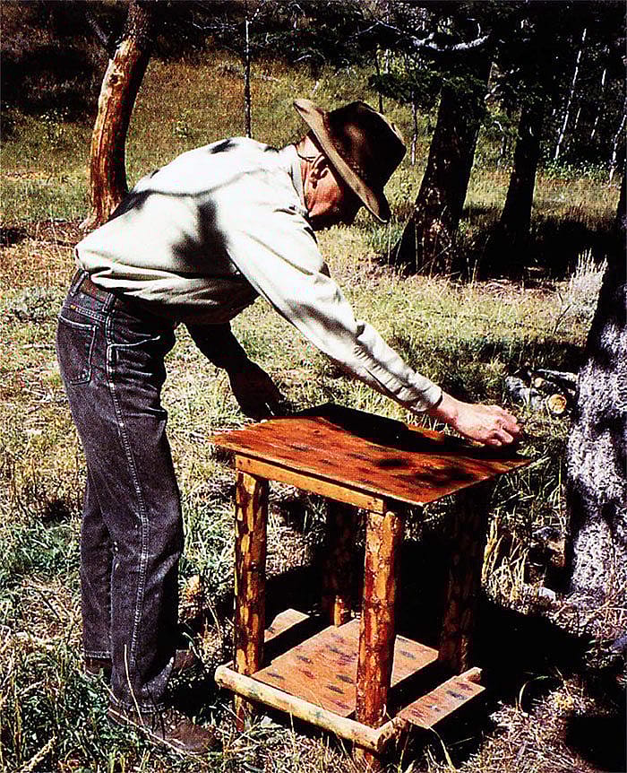 Caretaker Jim McGregor shows a beautiful example of Dunrud's furniture, which includes a skip-peeled finish and red and green polka dots. Photo by Joanita Monteith.