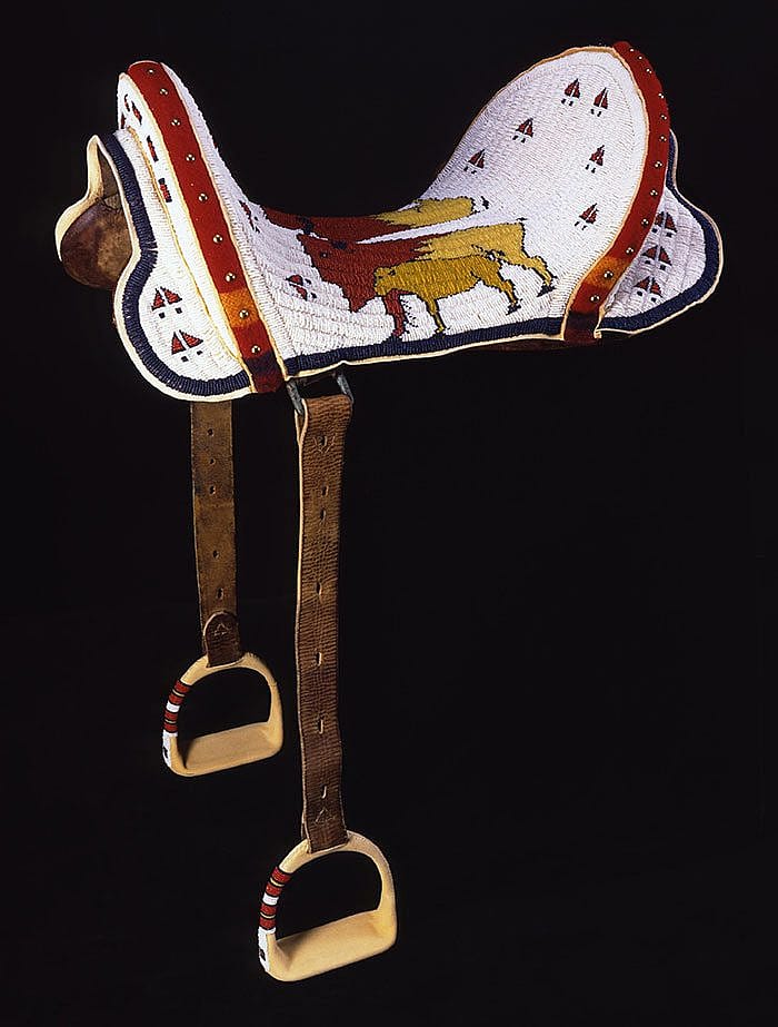 Beaded Saddle, Marcus Dewey, Northern Arapaho, Thermopolis, Wyoming, 1997. Tanned hide, glass beads, wool cloth, brass tacks, and McClellan saddle. Museum purchase with Funds provided by the Pilot Foundation. NA.403.203