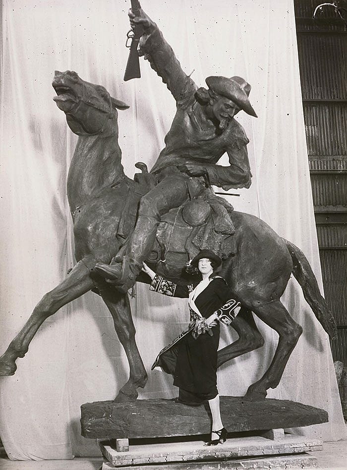 Before it traveled to Wyoming, Whitney posed with her sculpture of Cody, ca. 1923. Original Buffalo Bill Museum Collection photo. P.69.185