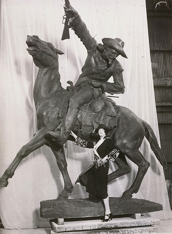 Before it traveled to Wyoming, Whitney posed with her sculpture of Cody, ca. 1923. Original Buffalo Bill Museum Collection photo. P.69.185