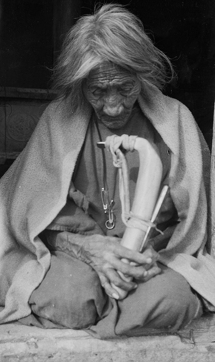 "Iron Teeth, age 92, holding elk horn hide scraper, 1927." Thomas B. Marquis worked with the Northern Cheyenne as a physician, but also researched and authored much local history and photographed many tribal members. This image, produced from his original nitrate negative, is one of his most evocative. MS 165 Thomas B. Marquis Collection. P.165.1.77