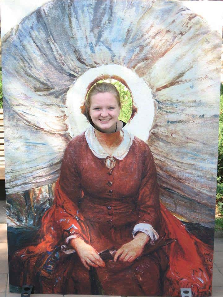 Young visitor poses with her face in a cutout re-creation of W.H.D. Koerner’s “Madonna of the Prairie” during a Family Fun Day at the Buffalo Bill Center.