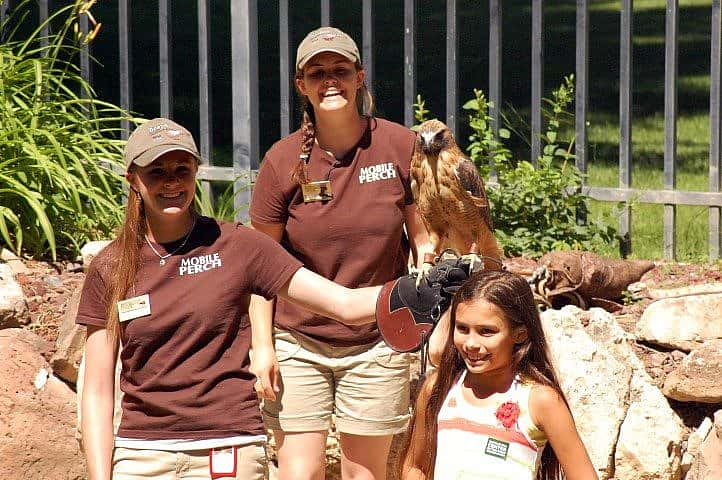 Katie & Nicole having fun on stage with a volunteer.