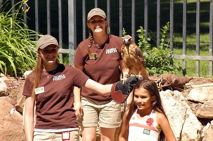 Katie & Nicole having fun on stage with a volunteer.