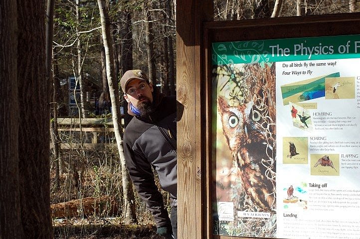 Brandon was definitely liking the signs at the Carolina Raptor Center.