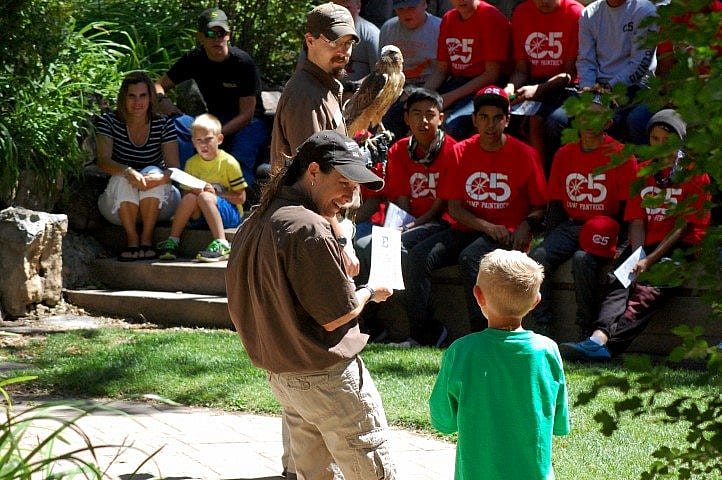 Carrie preps her volunteer during a "Superheroes of Nature" program.