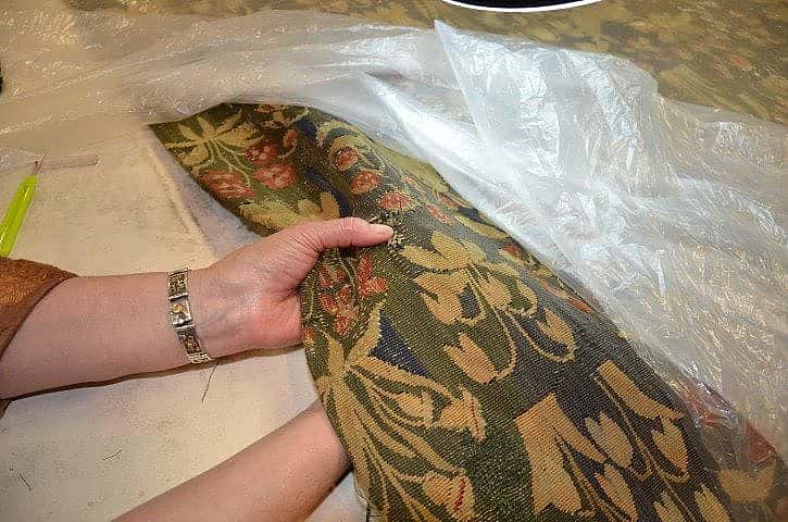 Repair of tapestry by hand sewing