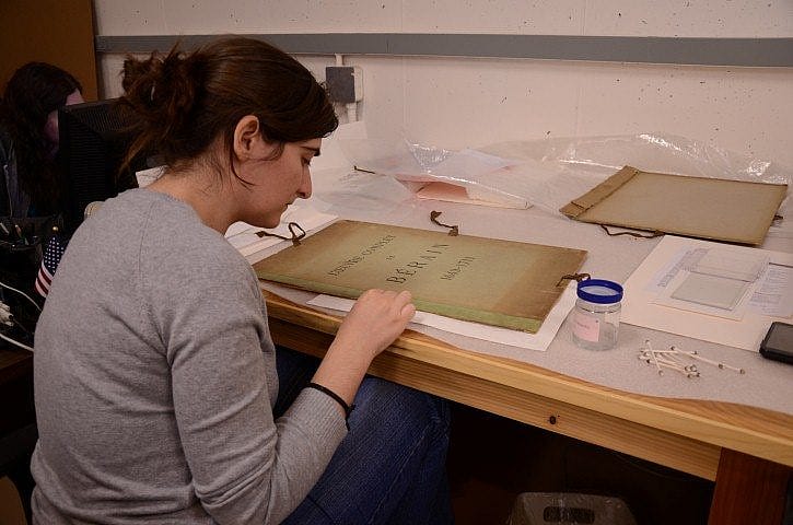 Laura Villar working on a book