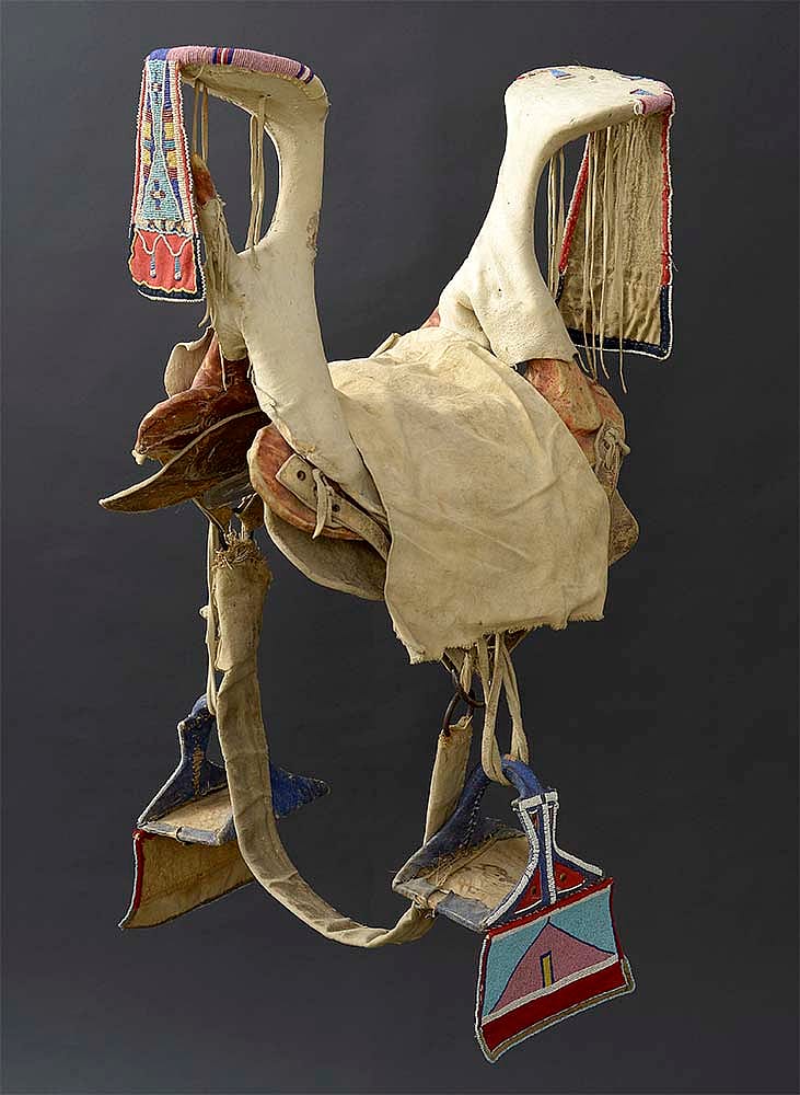 Crow saddle and stirrups, ca. 1900. Paul Dyck Plains Indian Buffalo Culture Collection, acquired through the generosity of the Dyck family and additional gifts of the Nielson Family and the Estate of Margaret S. Coe. NA.403.281