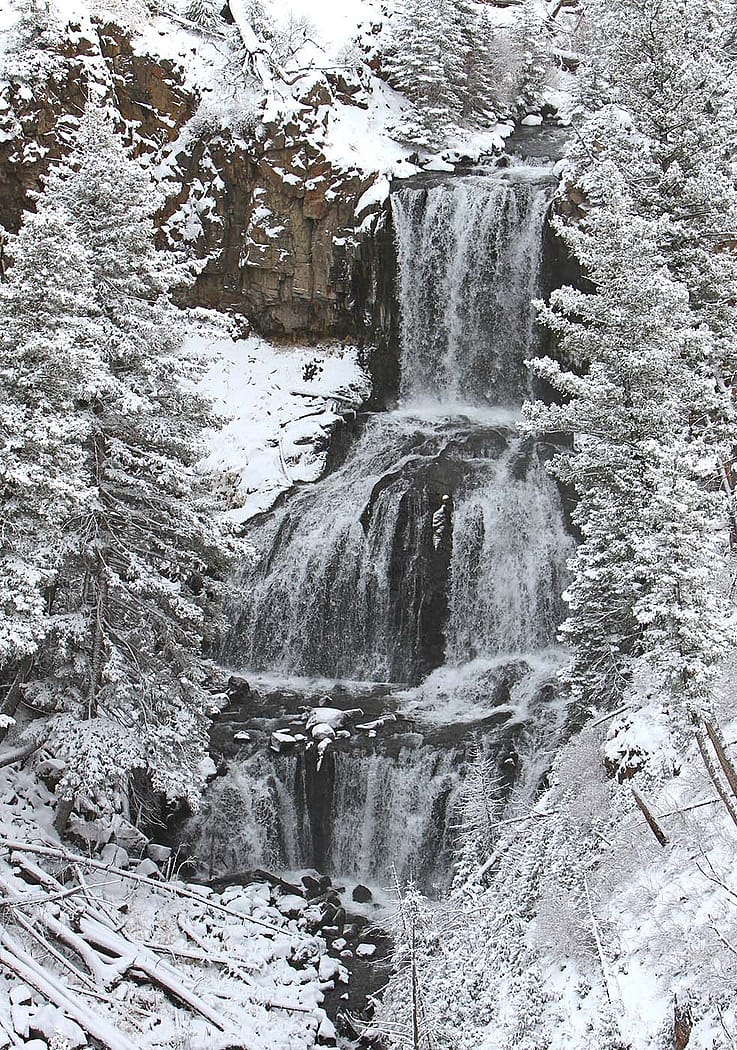 An early winter blanket of snow covers the landscape around Undine Falls in Yellowstone National Park. Photo by Jim Peaco.