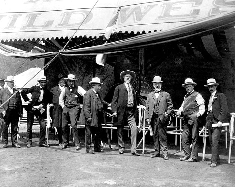 William F. Cody, James A. Bailey and other men at the entrance to the wild west show, ca. 1900. MS006 William F. Cody Collection. P.69.0986.