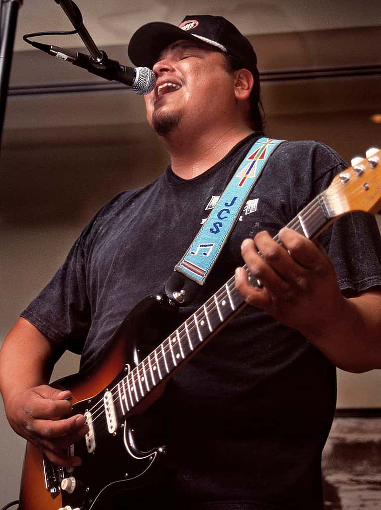 Musician, singer, and songwriter Jared Stewart of Crow Agency, Montana, performs a combination of blues, rock, and pop to open the 2004 Plains Indian Museum Seminar. The seminar celebrated the living traditions of music and dance for Native people of the Great Plains. Chris Gimmeson photo.