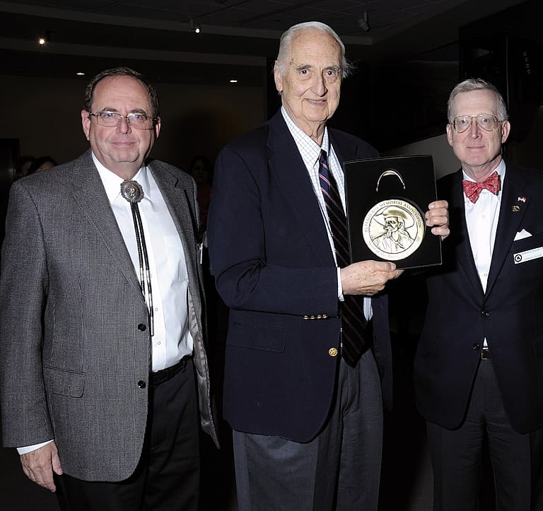 Willis McDonald IV, center, receives the Buffalo Bill Center of the West's Spirit of the West Award in 2012 with Bruce Eldredge (L), the Center's Executive Director and CEO, and Barron Collier II, Board of Trustees Chairman.