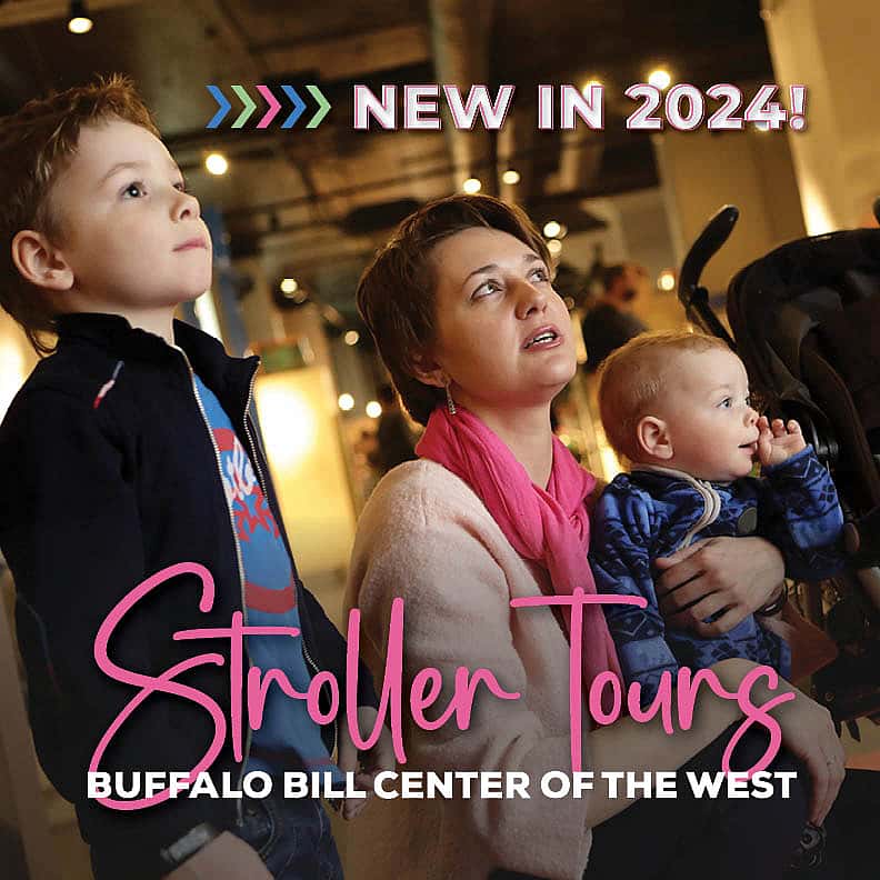 A young family with a stroller look at museum exhibits.