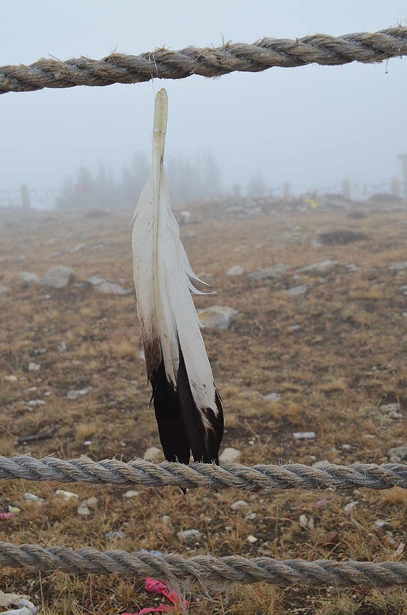 An eagle feather flutters in the breeze at Medicine Wheel in the Bighorn Mountains of Wyoming.