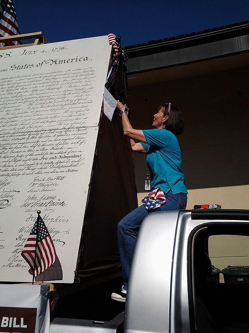 Ann Marie Donoghue hanging the stars