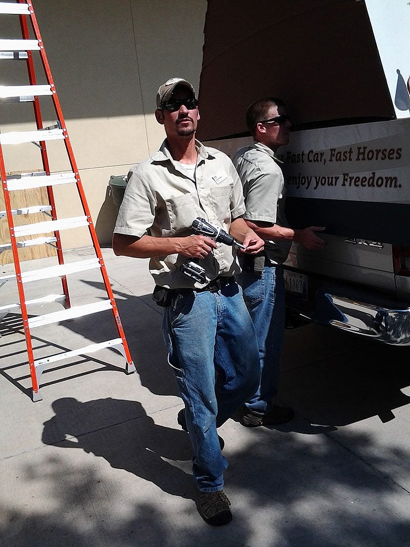 Dave Bryant and Dave Walsh assembling the float for the 4th of July