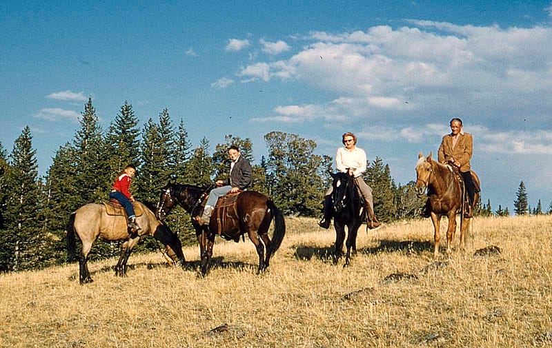 Four people on horseback. Coe Family