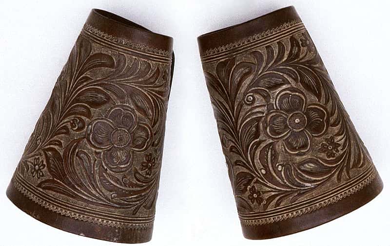 The F.A. Meanea Company of Cheyenne, Wyoming made these cuffs around 1861. Note the refined and detailed appearance of the carving. This is typical of the work done by this firm at that time. 1.69.1486a/b